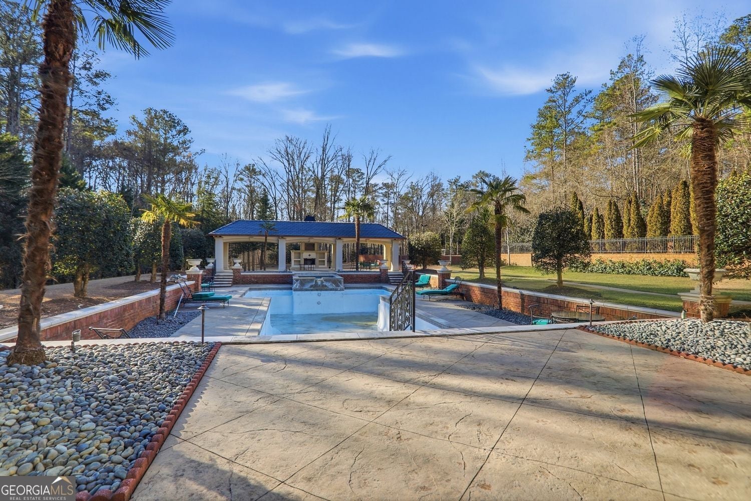 Set on 3.8 beautifully manicured acres, this elegant gated estate offe – image 138