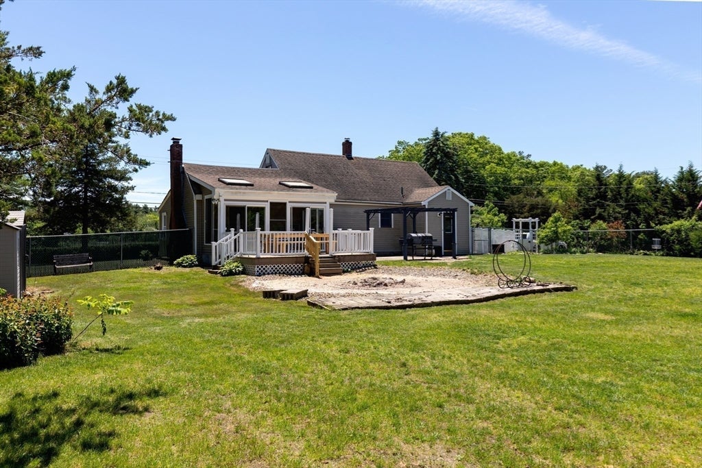 Nestled on over 2 acres, this Classic New England Cape offers the perf – image 32