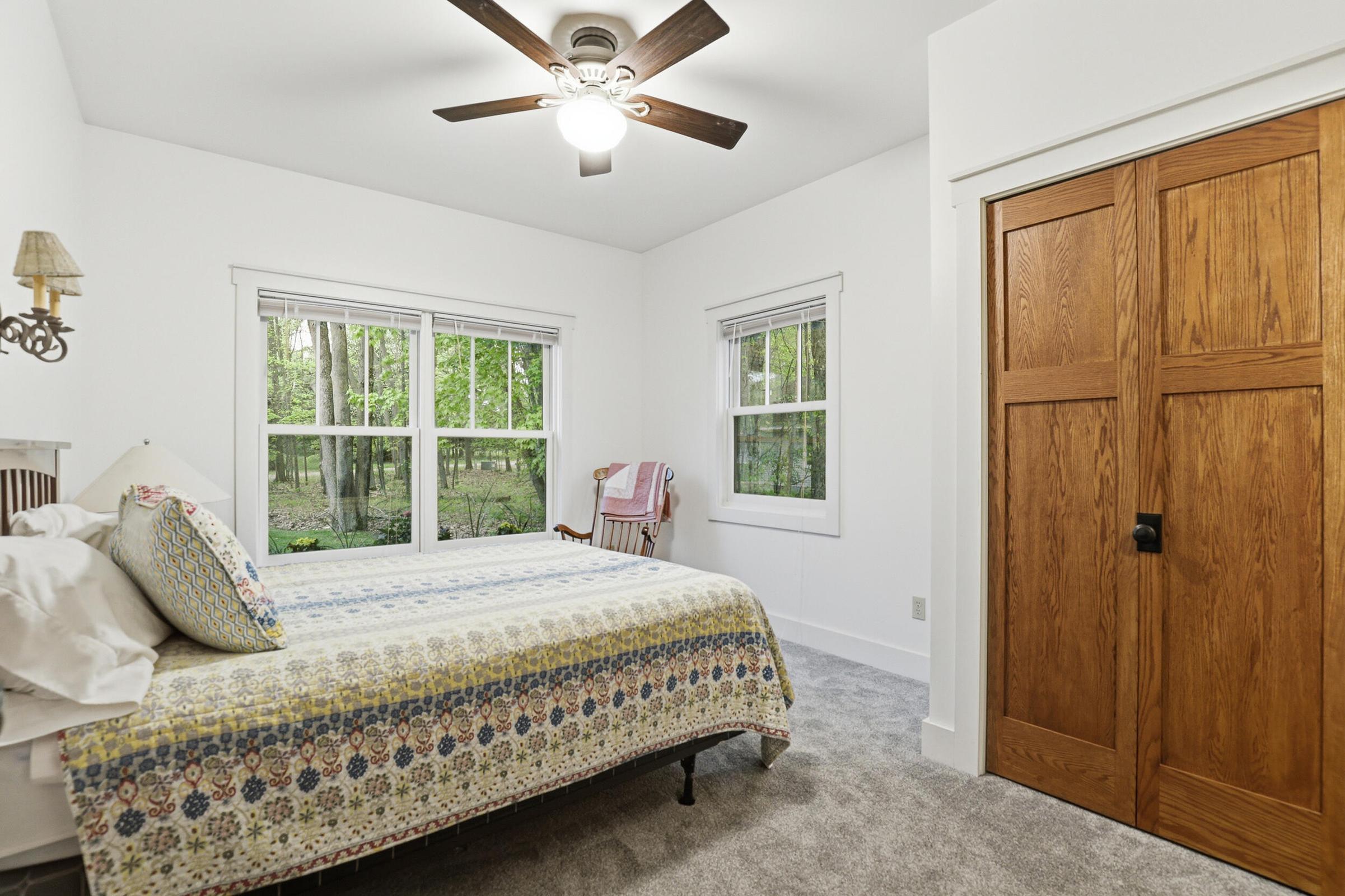 Tucked away on over an acre along the Little Muskegon River in the hea – image 32