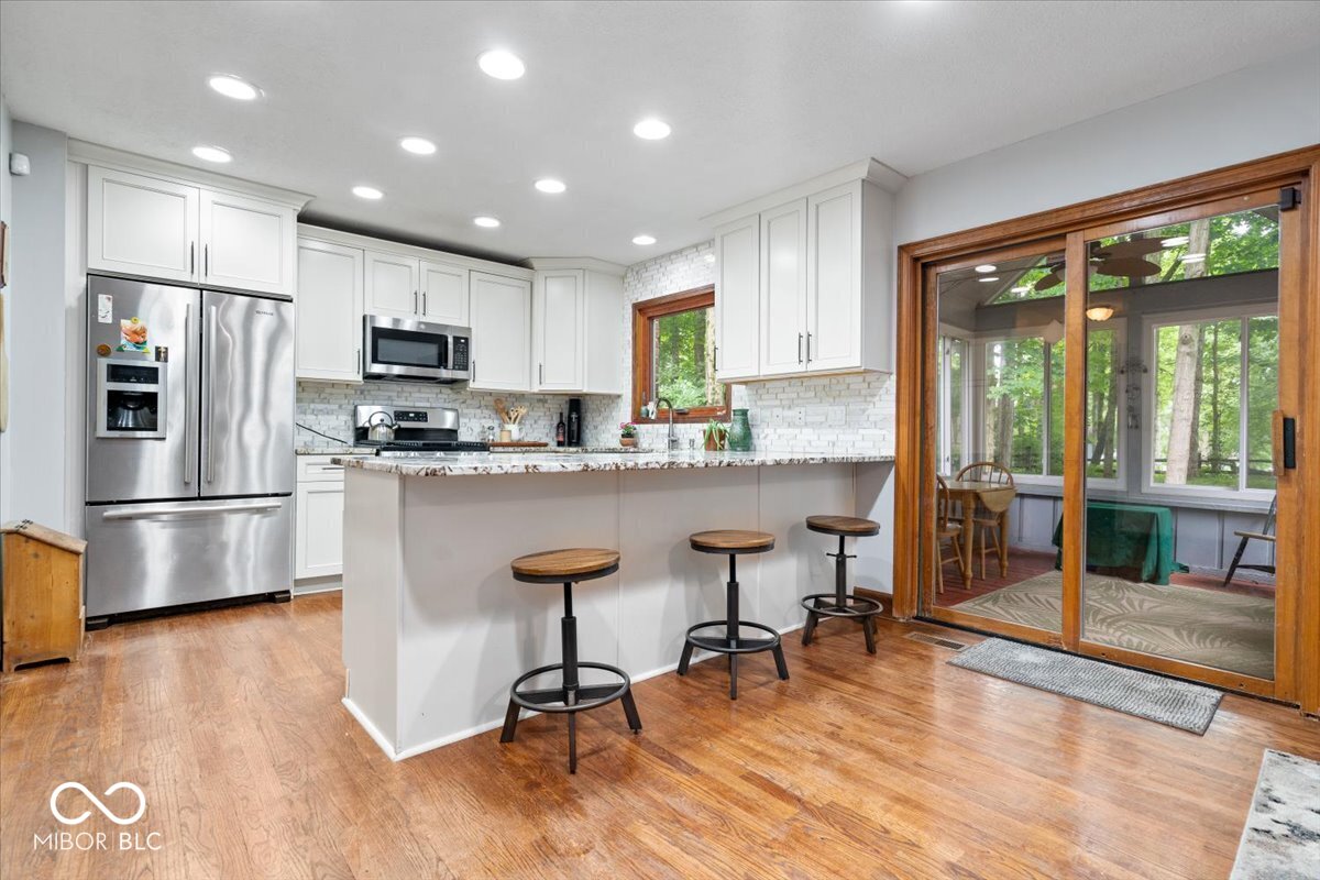 Updates galore in desirable Feather Cove III! Nestled on a half-acre w – image 12