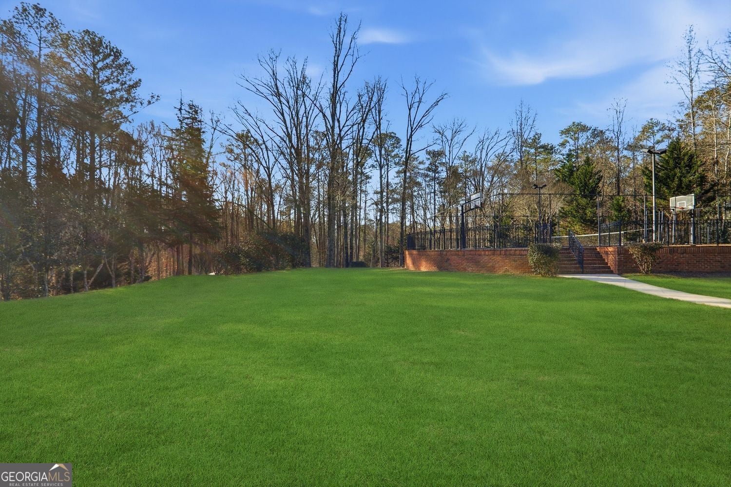Set on 3.8 beautifully manicured acres, this elegant gated estate offe – image 142