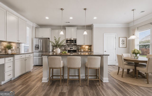 Flawlessly maintained and thoughtfully designed, this home exudes the – image 2