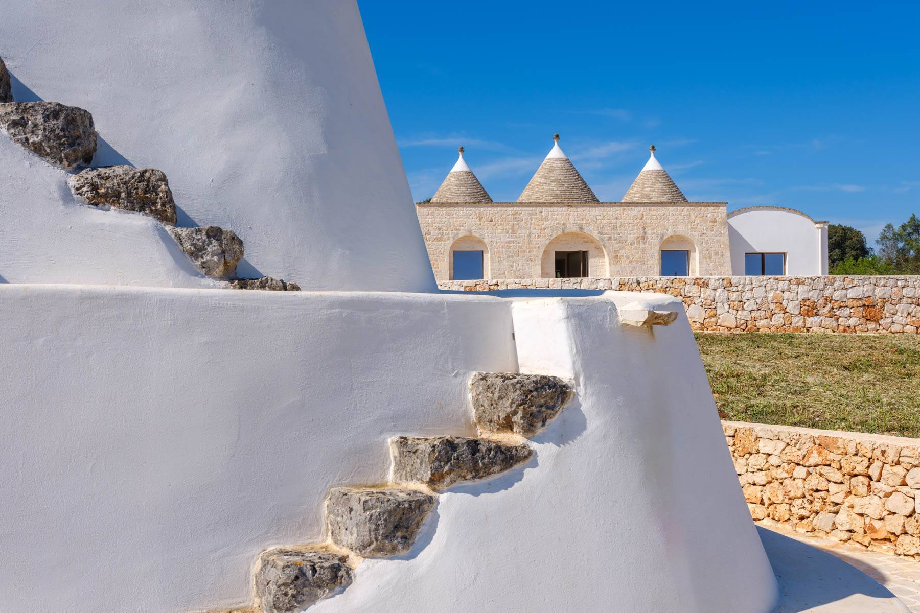 Bright lamia with trulli in the Itria Valley