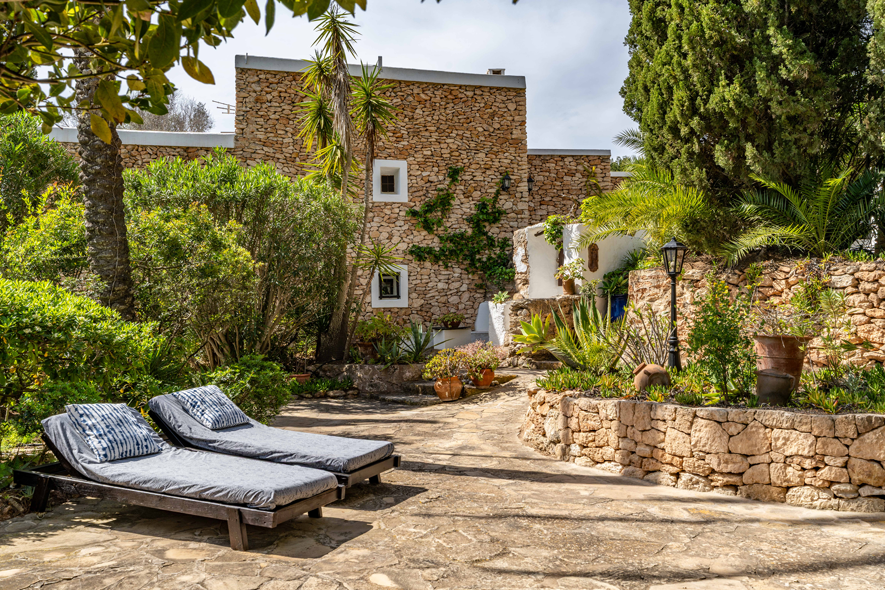 Ibicenca farmhouse with guest units and garden oasis in San José, Ibiza.