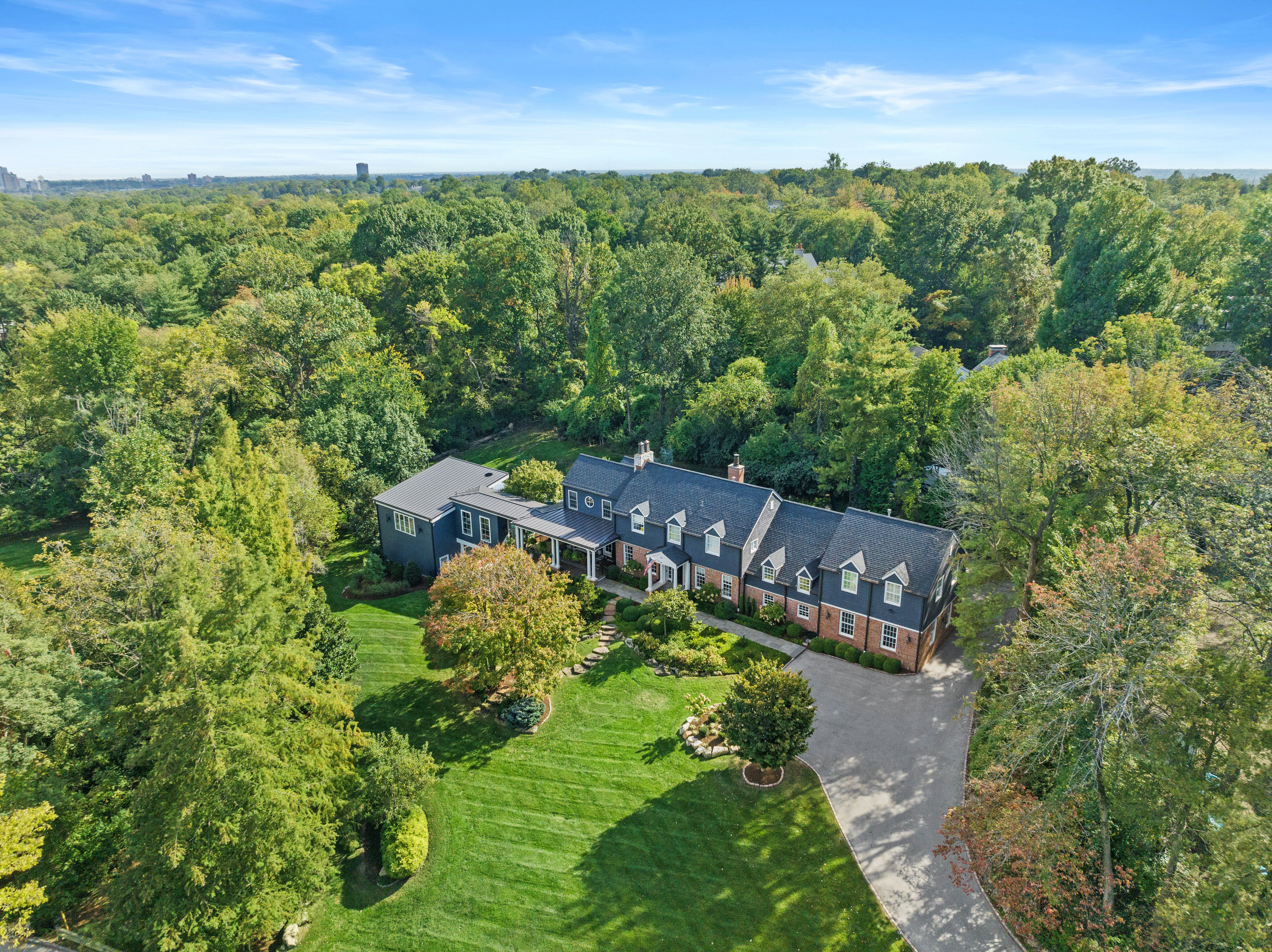  Stunning Private Estate Tucked Away on one of Ladue